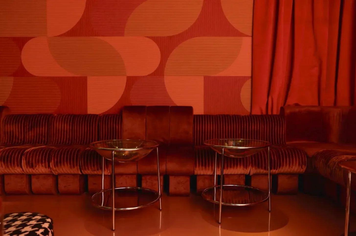 Salon Camarena - banquette seating under the graphic wall