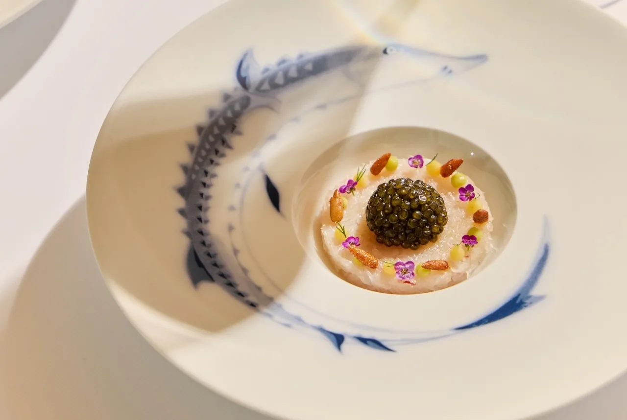 Sartoria by Paulo Airaudo - signature caviar course on a hand painted fish plate