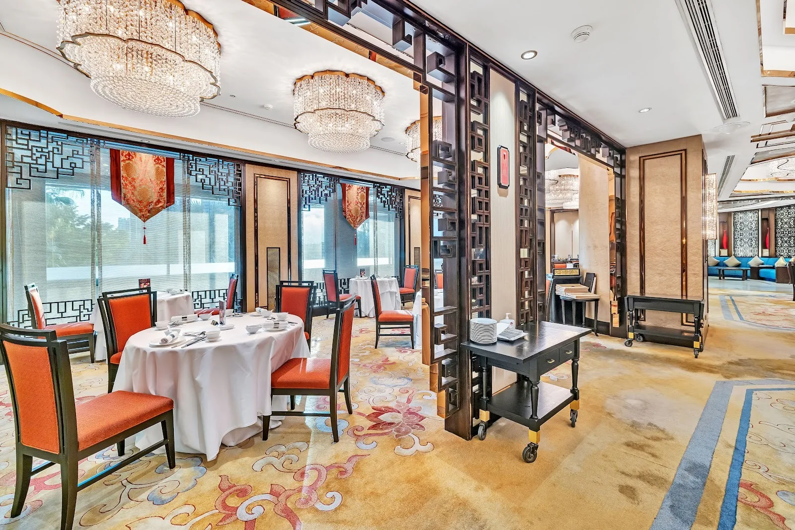 Shang Palace - red chair dining room river