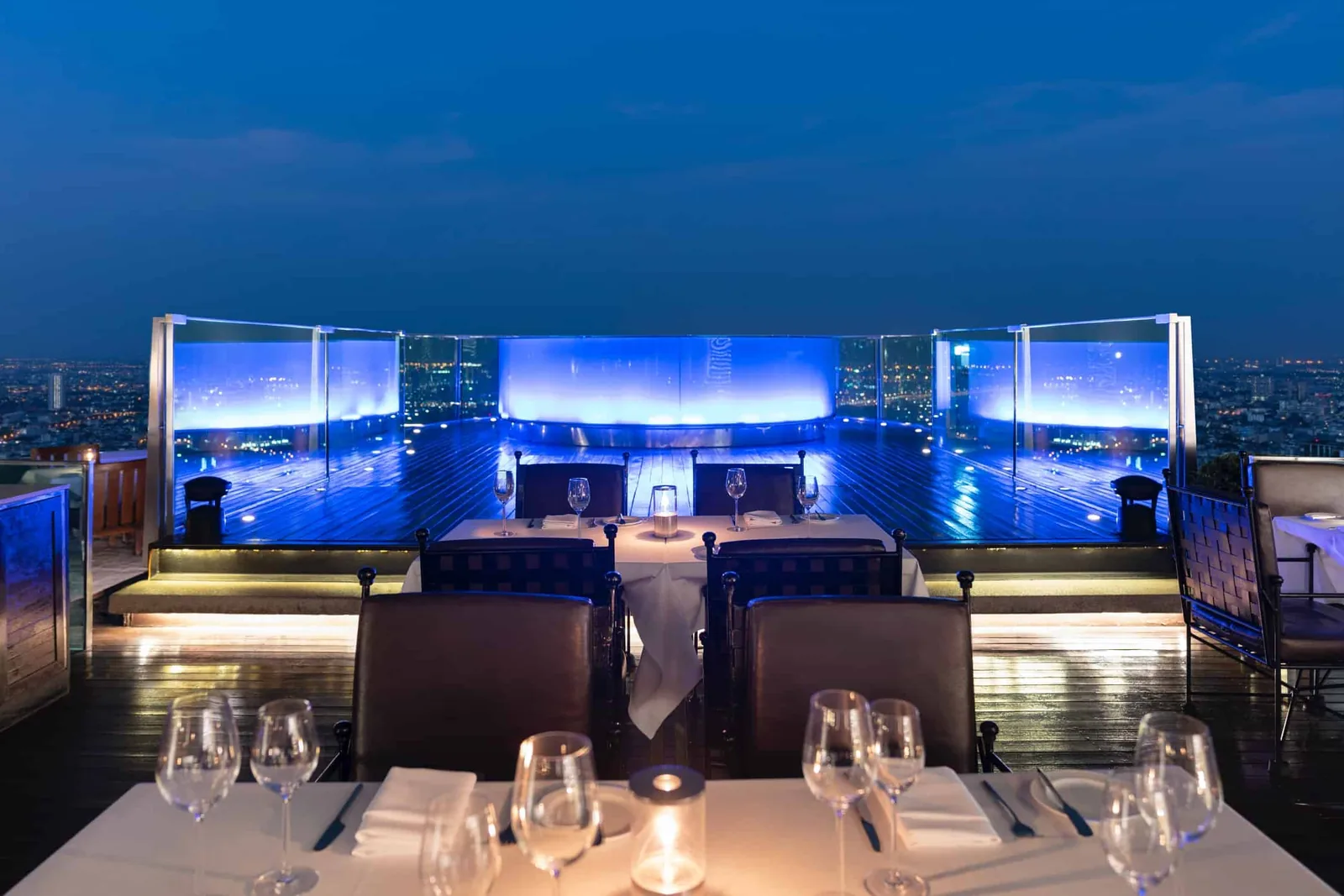Sky Bar - terrace dining tables city view