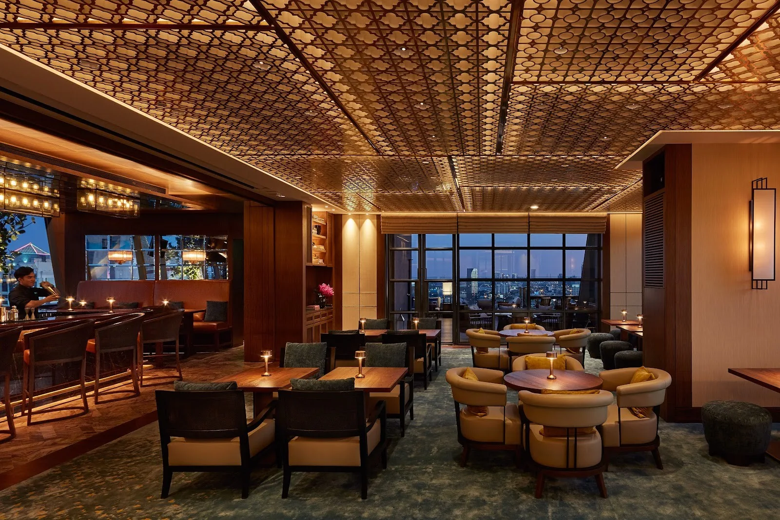 Spectrum Lounge - add indoor lounge evening armchairs low tables coffered ceiling city view windows