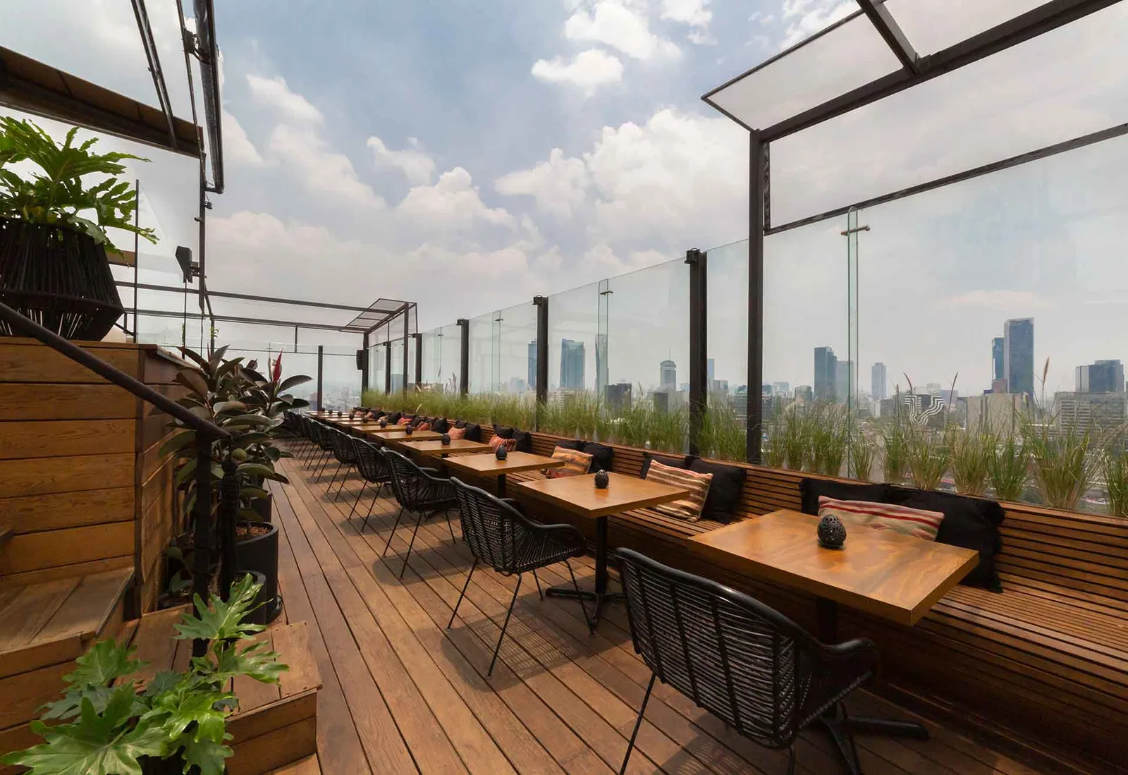Supra Roma Rooftop - terrace communal tables and planters wit