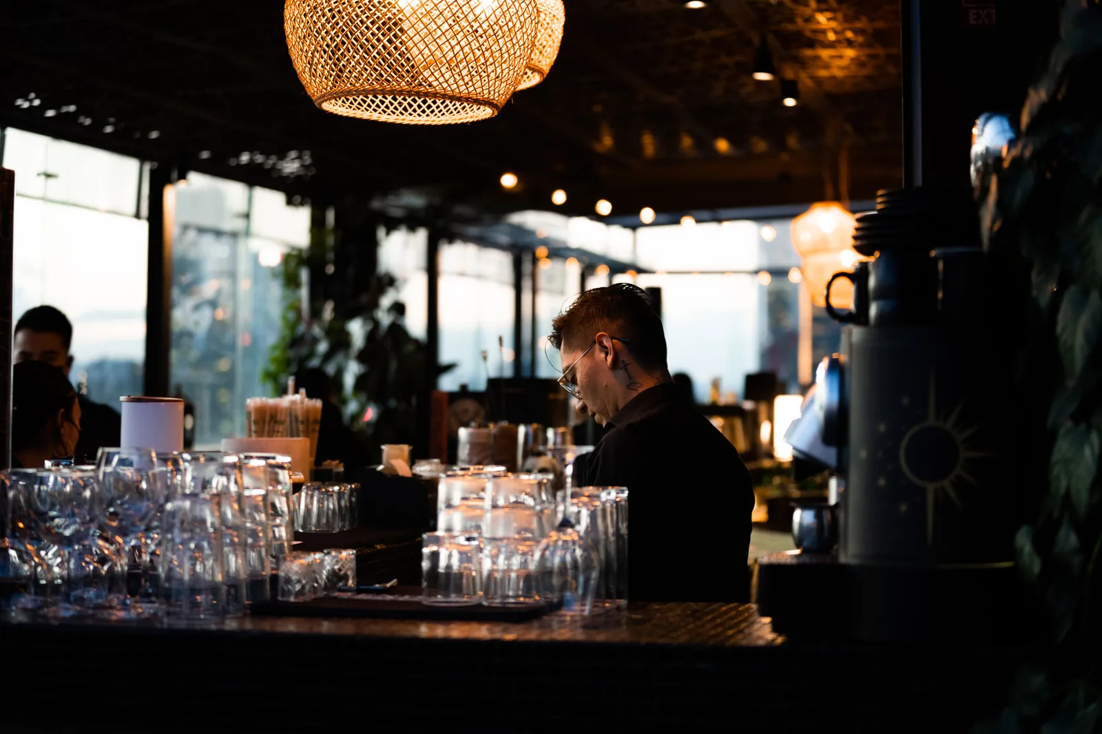 Supra Roma Rooftop - bartender at the indoor bar counter with