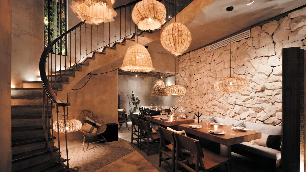 Taboo Polanco - stone wall dining room with spiral staircase