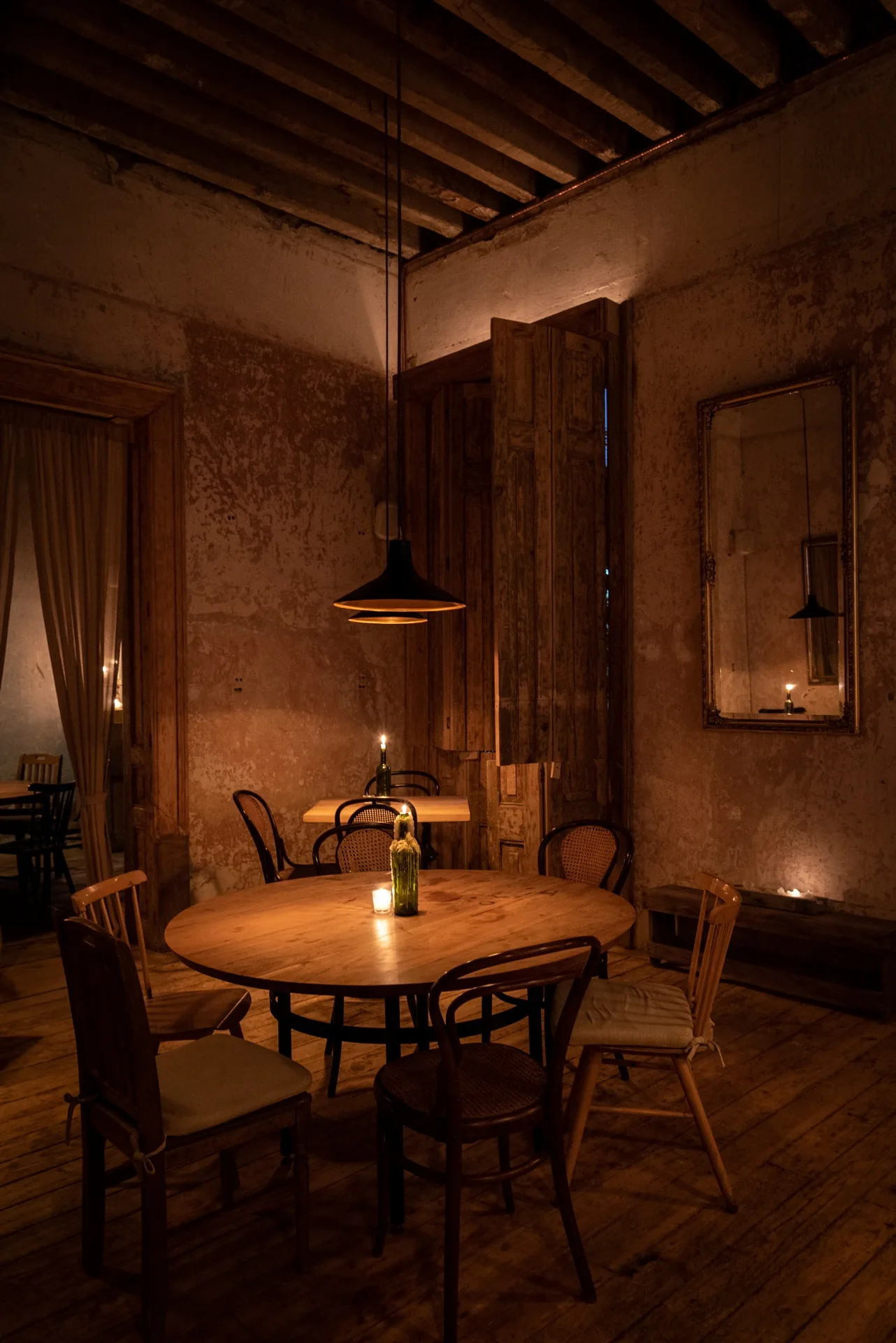 Taverna - rustic dining room with lime washed wall