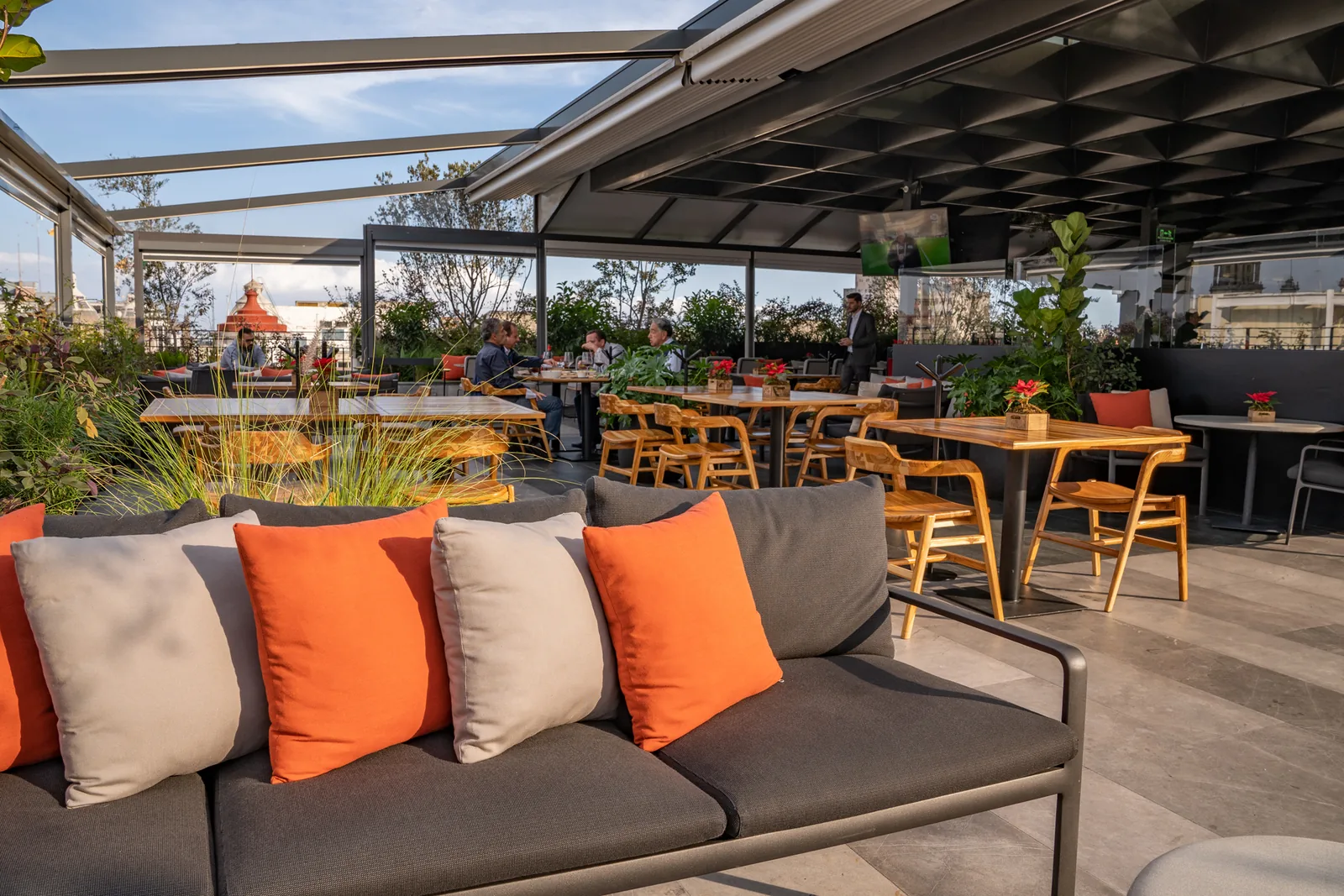 Terra Alta - terrace sofa with orange cushions under