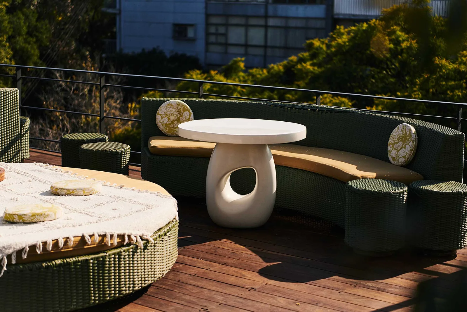 Terraza Condesa DF - sculptural white tables with the curved