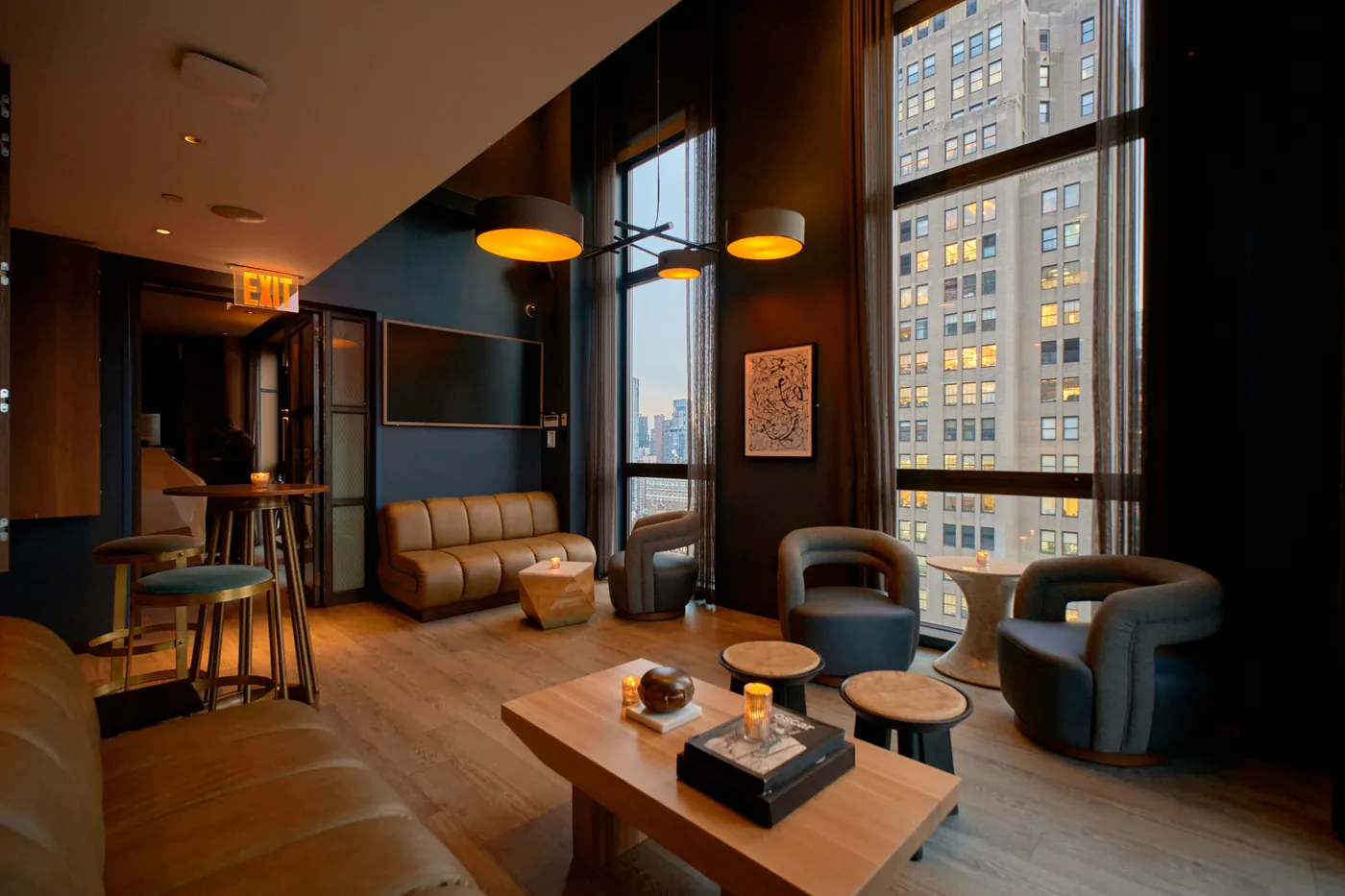 The Skylark - indoor lounge warm lighting floor to ceiling windows