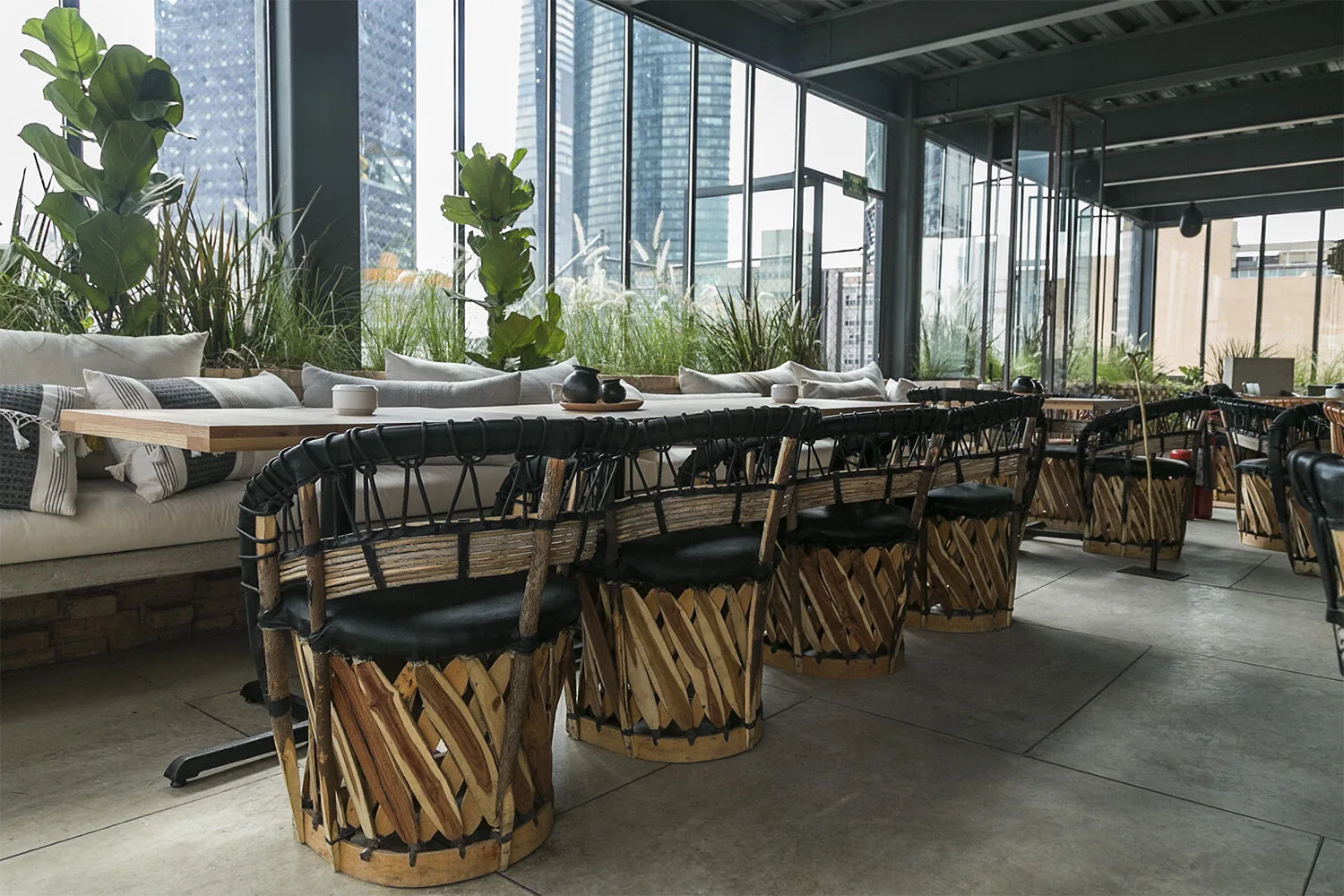 Toledo Rooftop - glass walled indoor dining area with wov