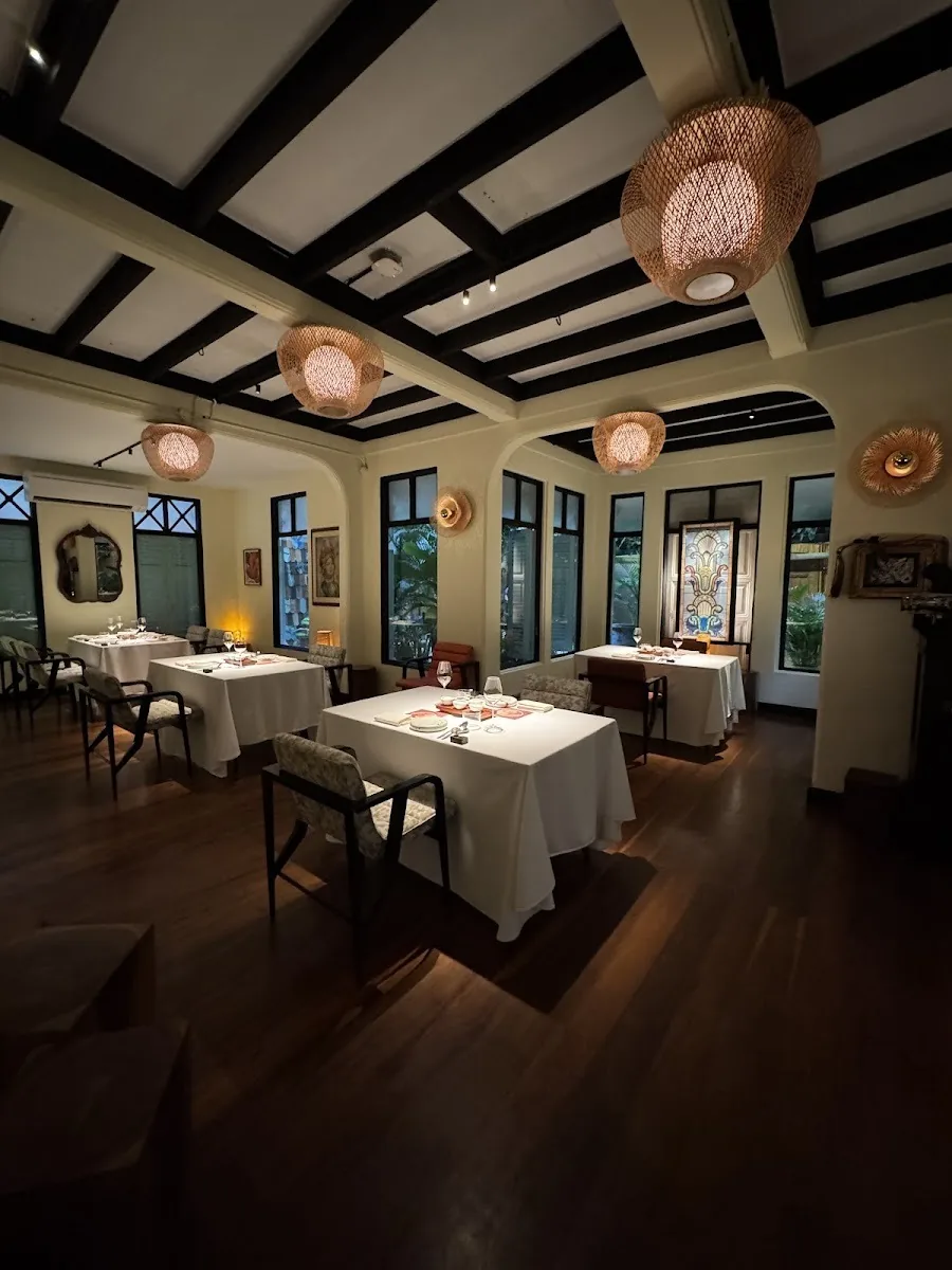 Wana Yook - main dining room black beamed ceiling and windows