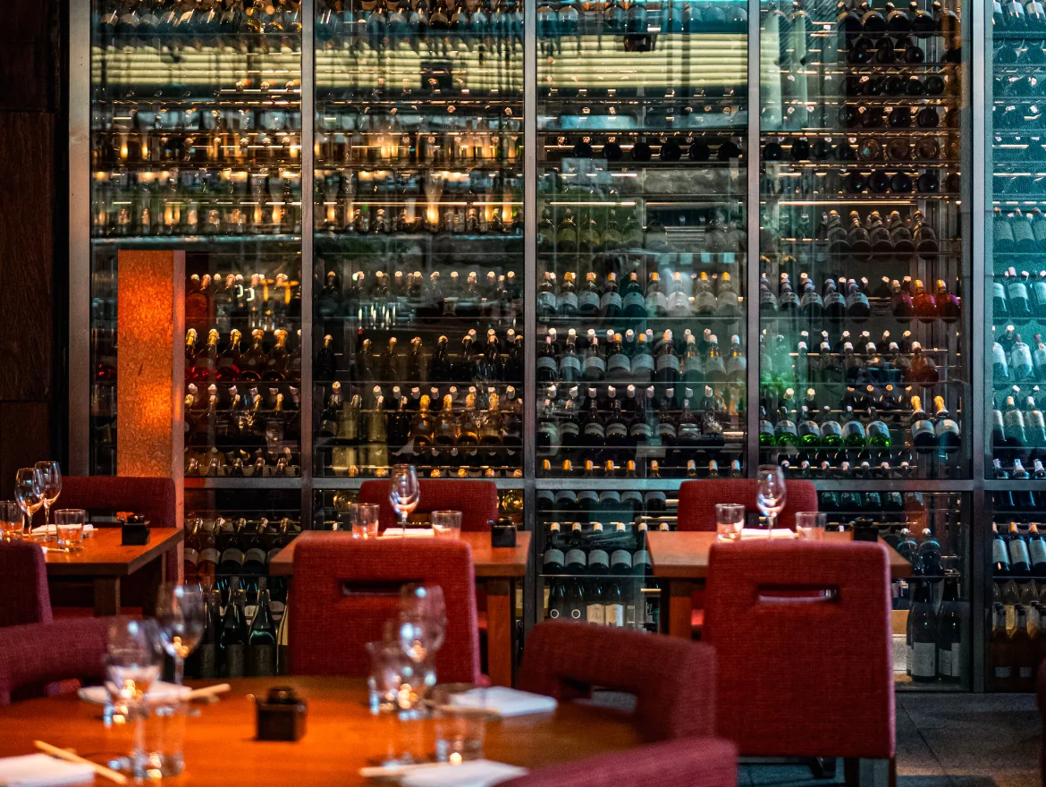 Zuma - wine cellar wall 400 wine labels and 50 sakes framing the dining room non food interior